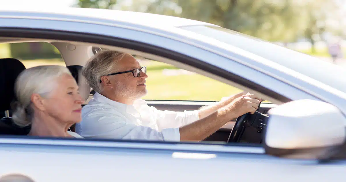 elderly-couple-driving-vehicle