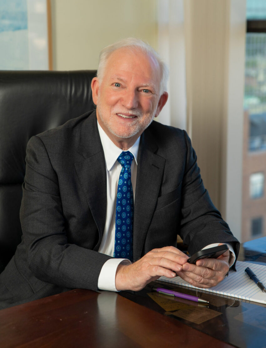 Joseph Rhoades at his desk