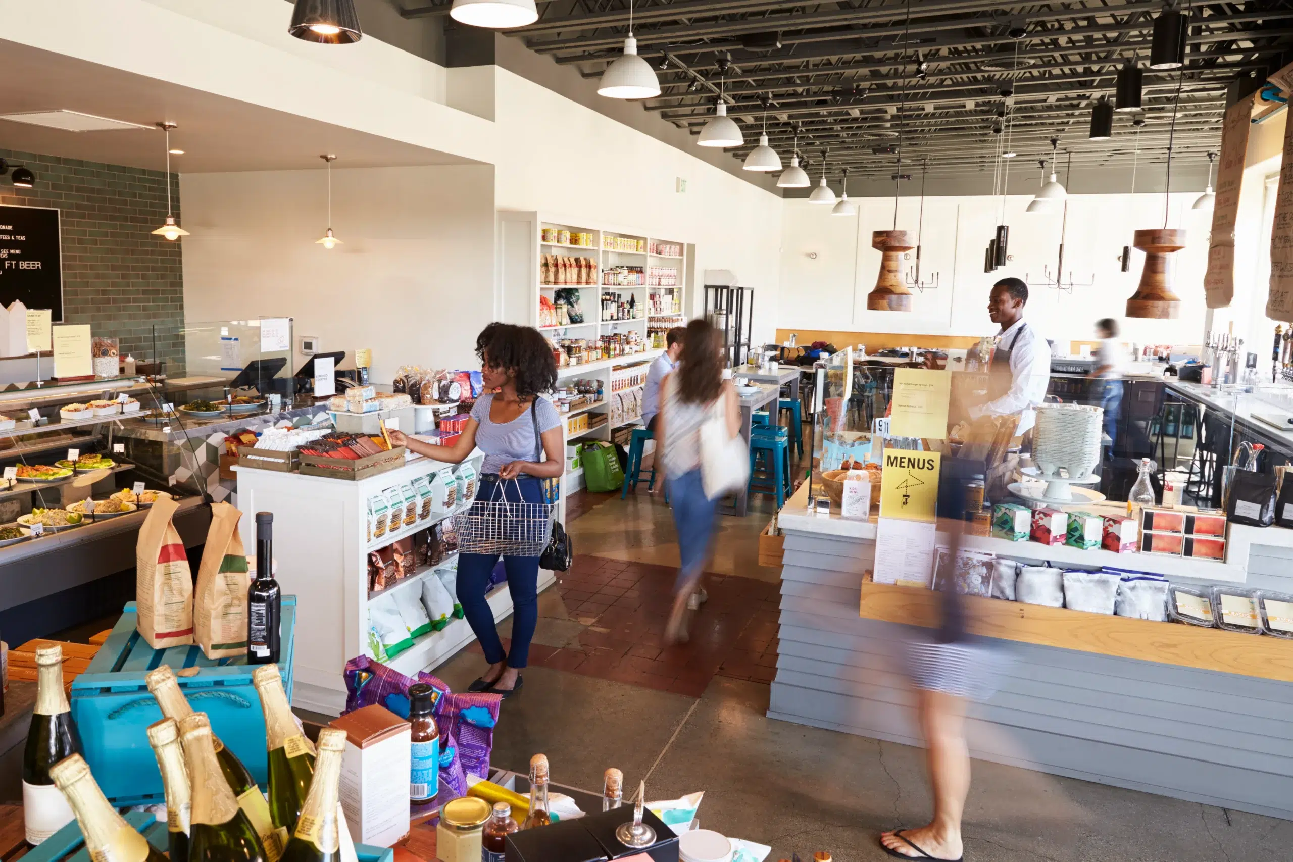 interior of busy delicatessen with customers