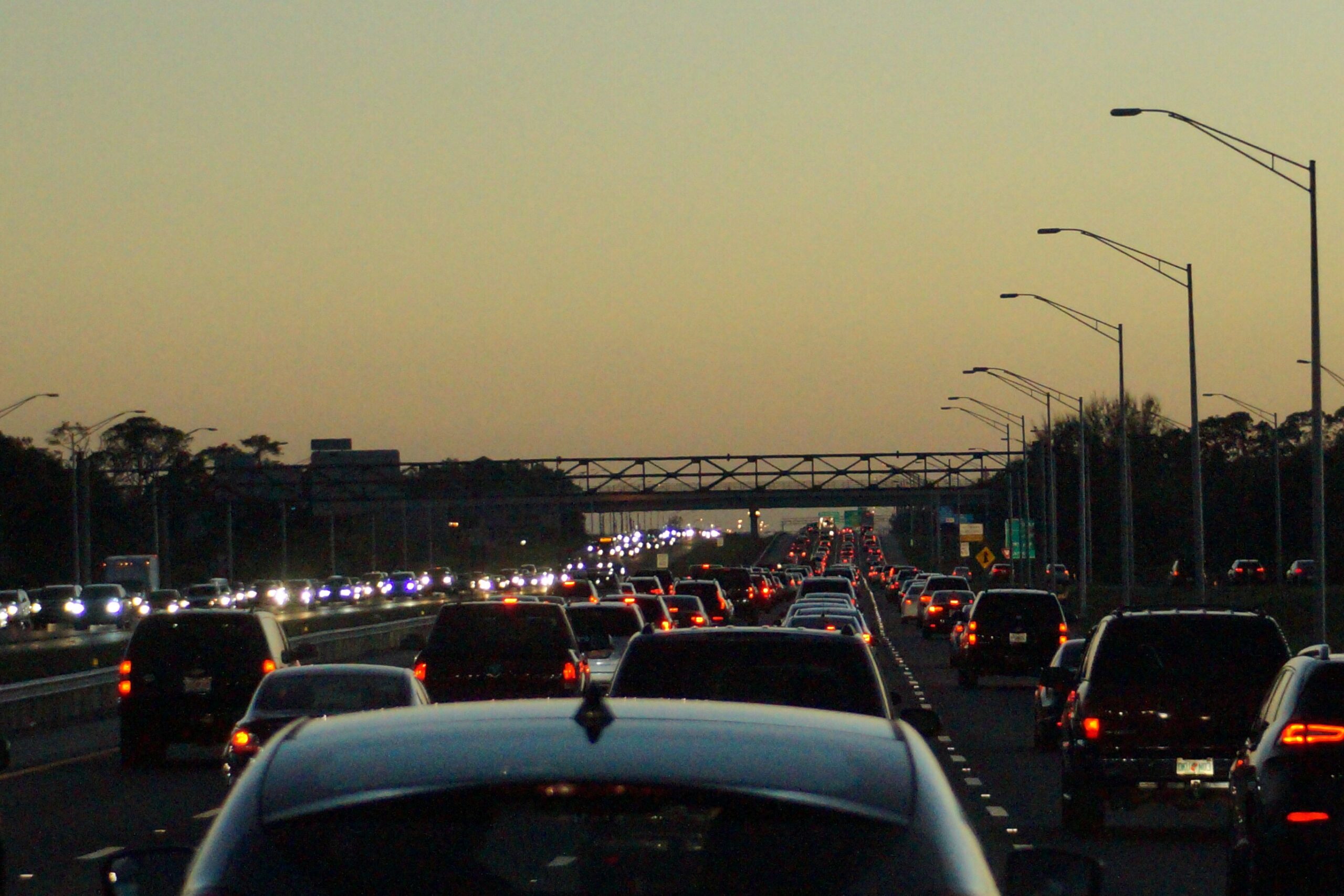traffic congestion on a highway at dusk